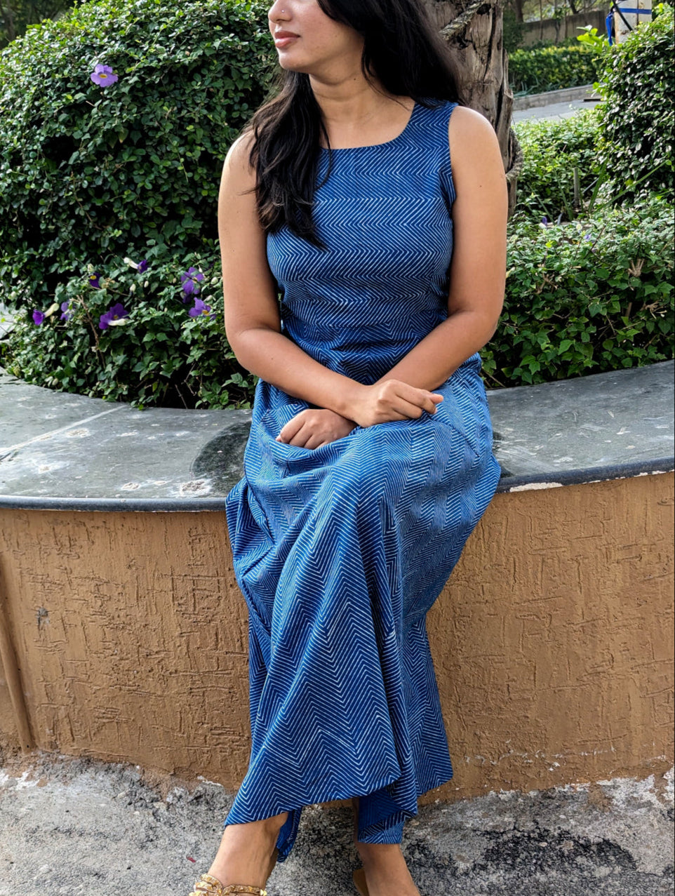Front view of full-length indigo cotton dress with pocket below waist and subtle Dabu white stripes