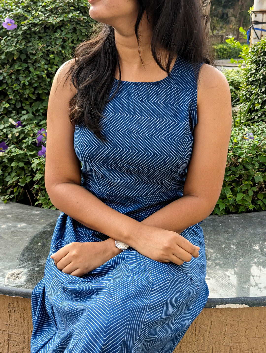 Front view of sleeveless indigo Dabu cotton dress with clean silhouette and round neckline